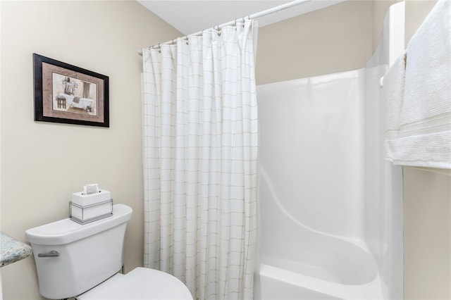 bathroom with shower / bath combination with curtain and toilet