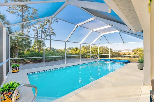 view of pool with a lanai and a patio