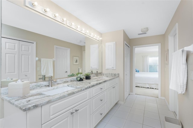 bathroom with vanity and tile patterned floors