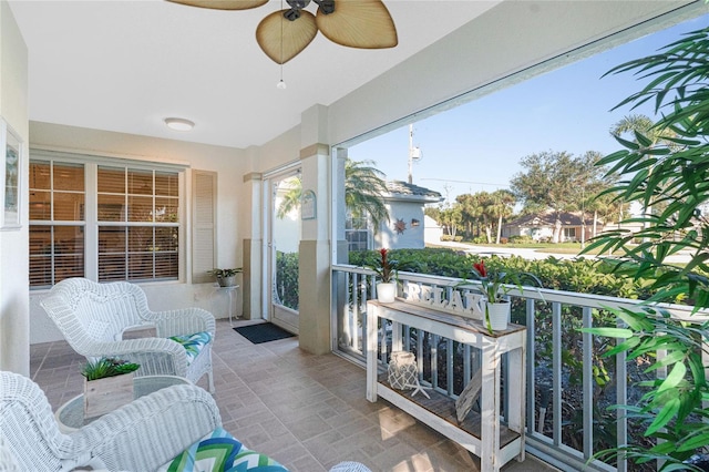 sunroom / solarium with ceiling fan