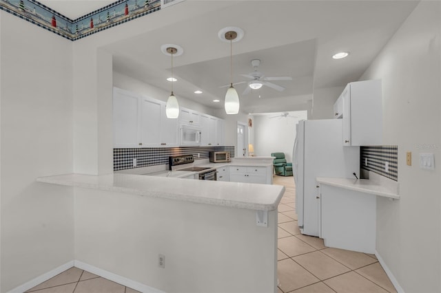 kitchen with kitchen peninsula, white appliances, white cabinetry, and ceiling fan