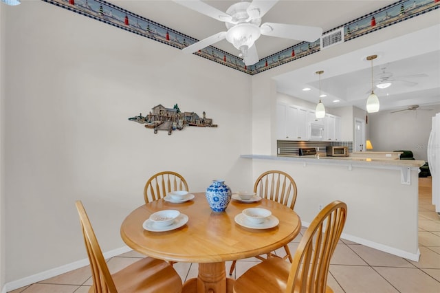 dining room featuring ceiling fan and light tile patterned floors