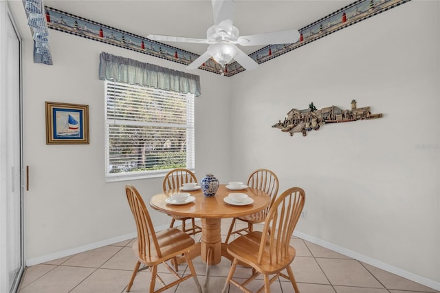 dining area with light tile patterned floors and ceiling fan