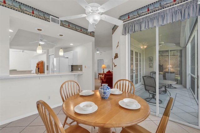 dining area featuring light tile patterned floors