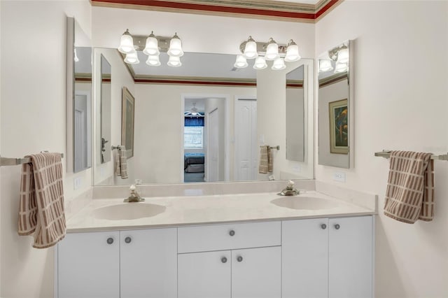 bathroom featuring vanity, ceiling fan, and crown molding