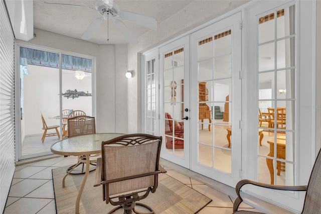 interior space featuring french doors and ceiling fan