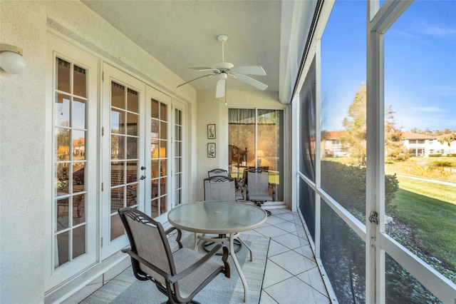 sunroom / solarium with french doors and ceiling fan