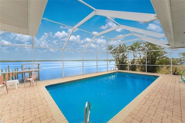 view of swimming pool with a boat dock, a patio area, a water view, and glass enclosure