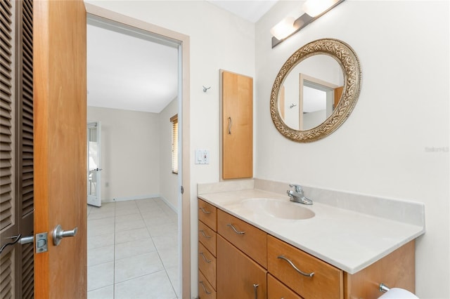 bathroom with tile patterned floors and vanity