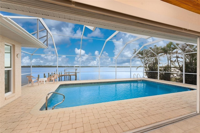 view of swimming pool with a lanai, a dock, a water view, and a patio