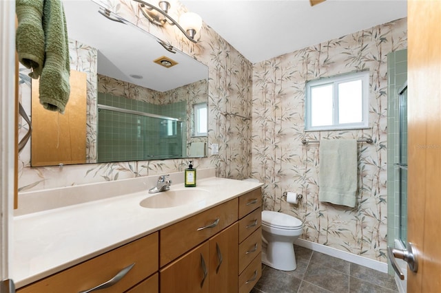 full bath featuring a shower stall, wallpapered walls, baseboards, toilet, and vanity