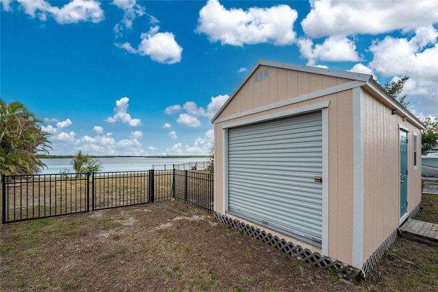 exterior space featuring a water view and fence