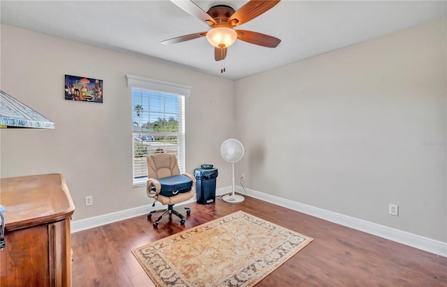 office space featuring dark hardwood / wood-style floors and ceiling fan