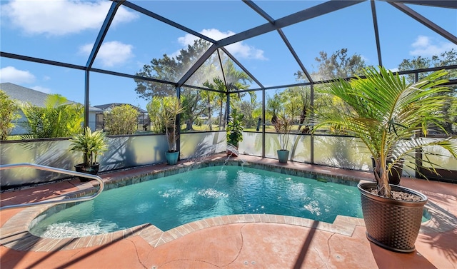 view of swimming pool featuring a lanai and a patio area