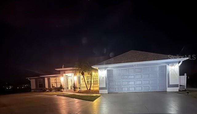 view of front of property with a garage