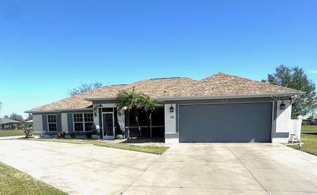 ranch-style house featuring a garage