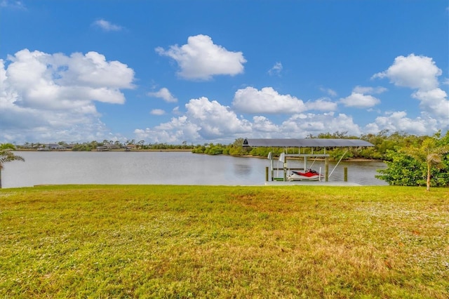 dock area featuring a yard and a water view