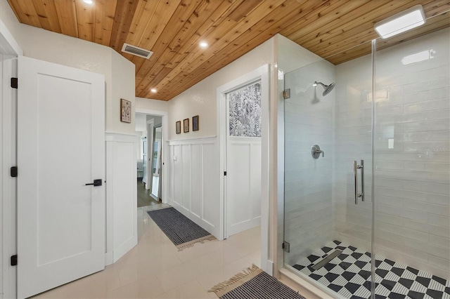 bathroom featuring wood ceiling and a shower with door