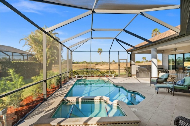 view of pool featuring ceiling fan, a lanai, an in ground hot tub, a grill, and a patio area