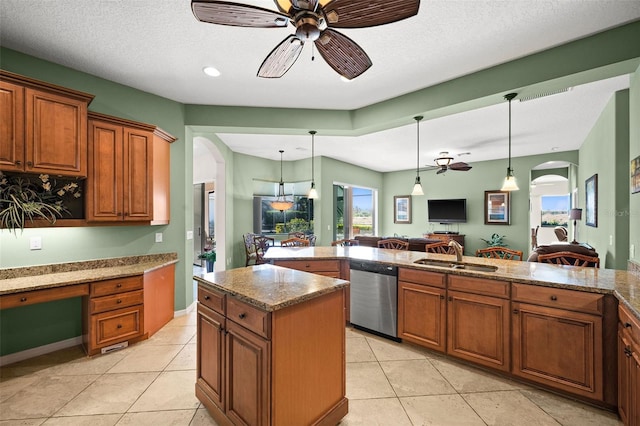 kitchen featuring dishwasher, a textured ceiling, ceiling fan, and sink