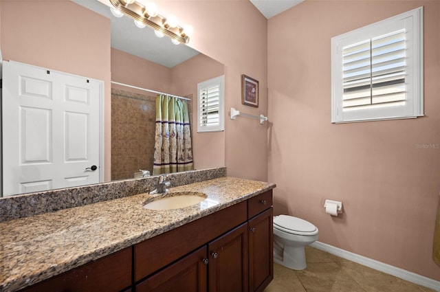 bathroom with tile patterned flooring, a shower with curtain, vanity, and toilet