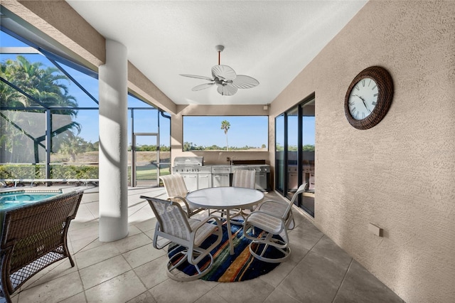 sunroom featuring ceiling fan