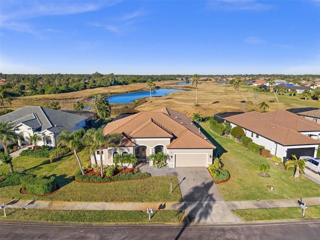 birds eye view of property with a water view