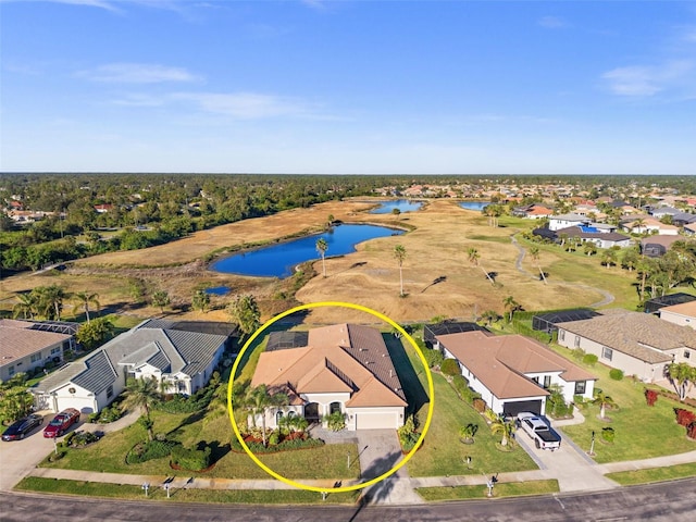 drone / aerial view with a water view