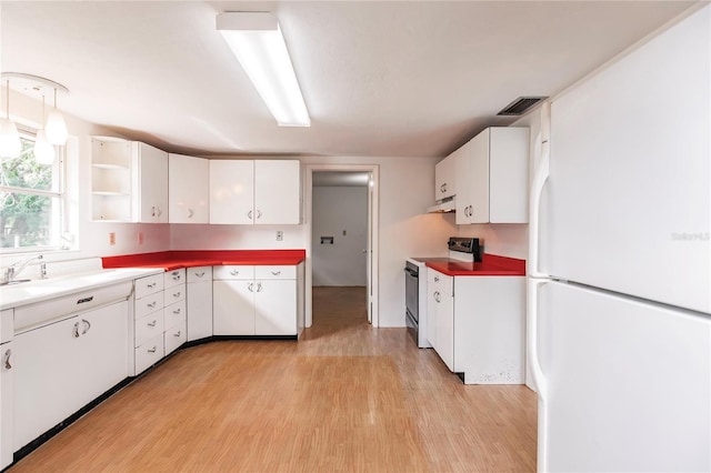 kitchen with white refrigerator, light hardwood / wood-style floors, white cabinetry, and stainless steel range with electric stovetop