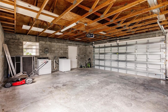 garage featuring washer / clothes dryer and a garage door opener