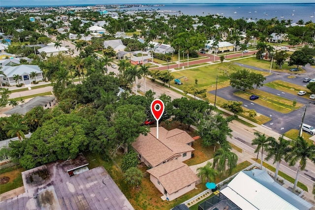 birds eye view of property with a water view