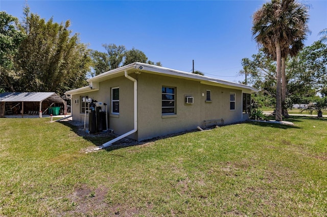 view of side of home featuring a lawn