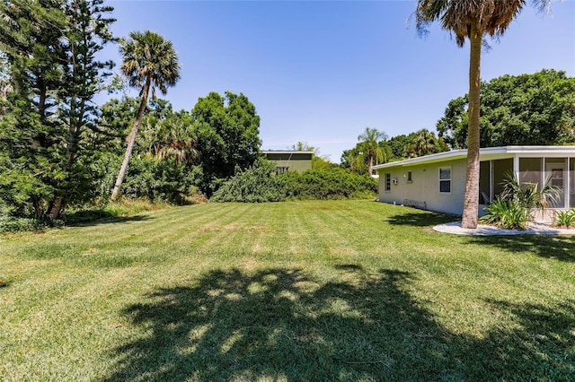 view of yard featuring a sunroom