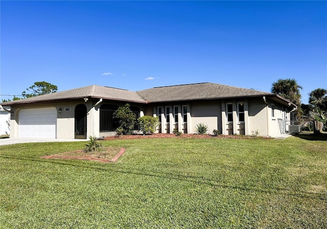 ranch-style home featuring a front yard and a garage