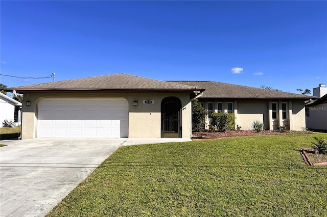 ranch-style house with a garage and a front yard