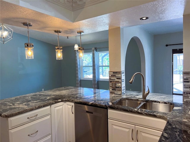 1196 Hinton St, Port Charlotte, FL 33952 - kitchen with stainless steel dishwasher, a textured ceiling, white cabinetry, and dark stone countertops