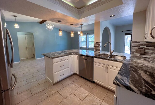 kitchen featuring hanging light fixtures, kitchen peninsula, sink, appliances with stainless steel finishes, and white cabinetry