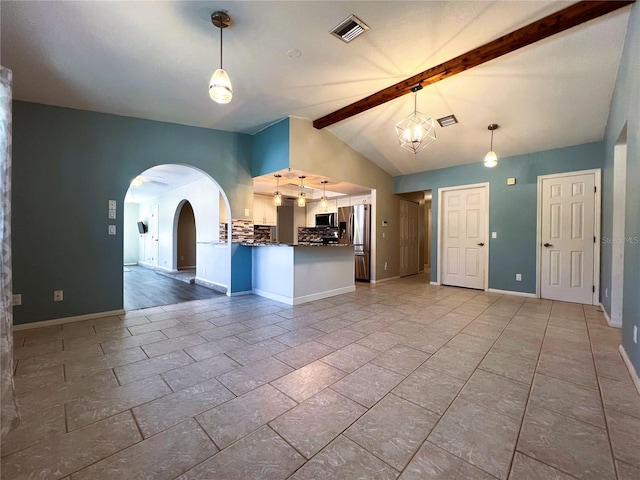 interior space with vaulted ceiling with beams and a chandelier