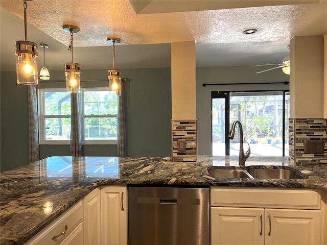 1196 Hinton St, Port Charlotte, FL 33952 - kitchen with dishwasher, a textured ceiling, plenty of natural light, ceiling fan, and white cabinetry