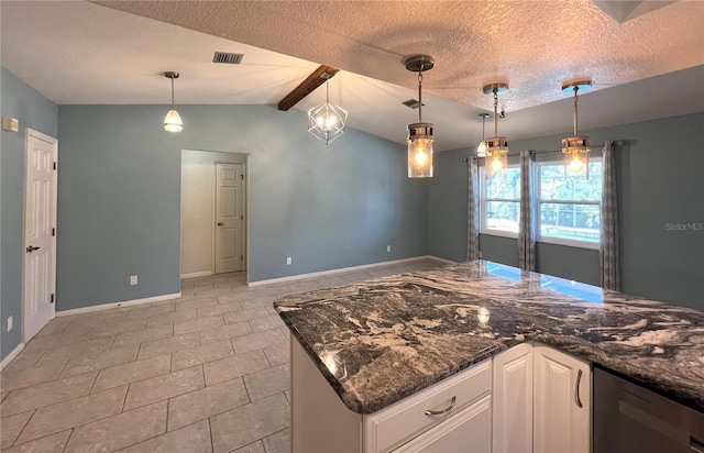 kitchen with a textured ceiling, light tile patterned floors, decorative light fixtures, white cabinets, and vaulted ceiling with beams