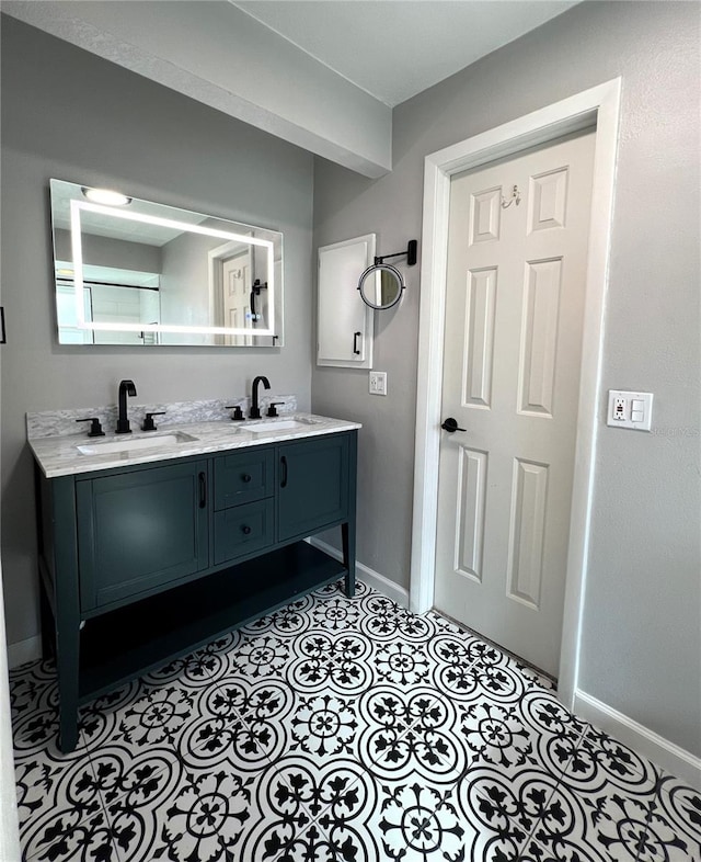 1196 Hinton St, Port Charlotte, FL 33952 - bathroom with baseboards and double vanity