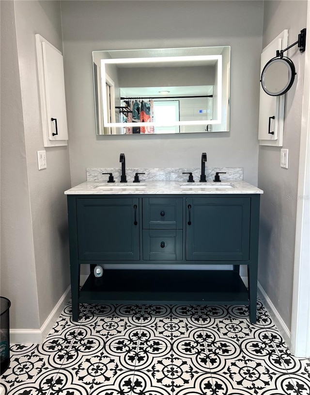 bathroom with tile patterned flooring and vanity