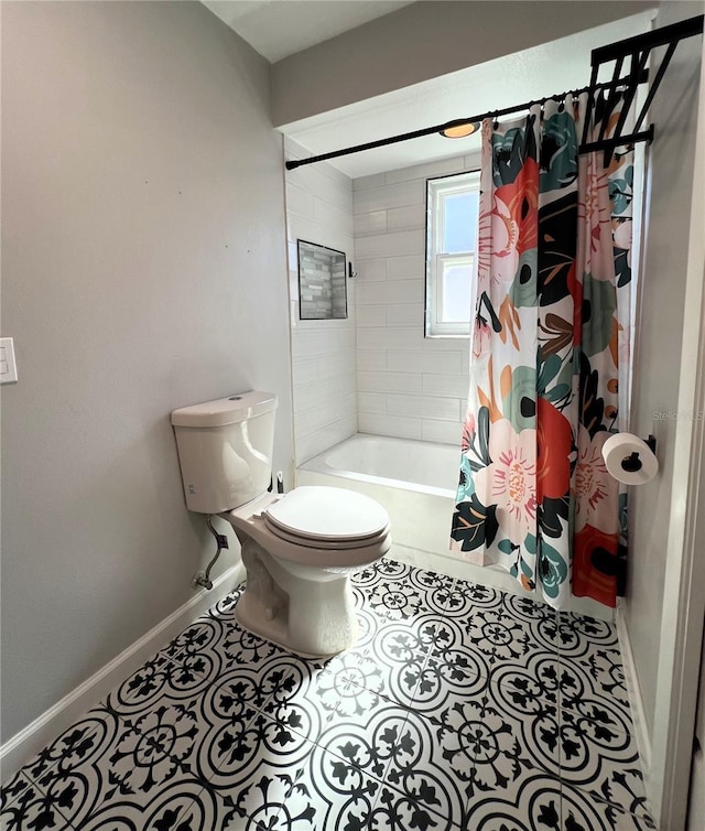 bathroom with shower / bath combo with shower curtain, tile patterned flooring, and toilet