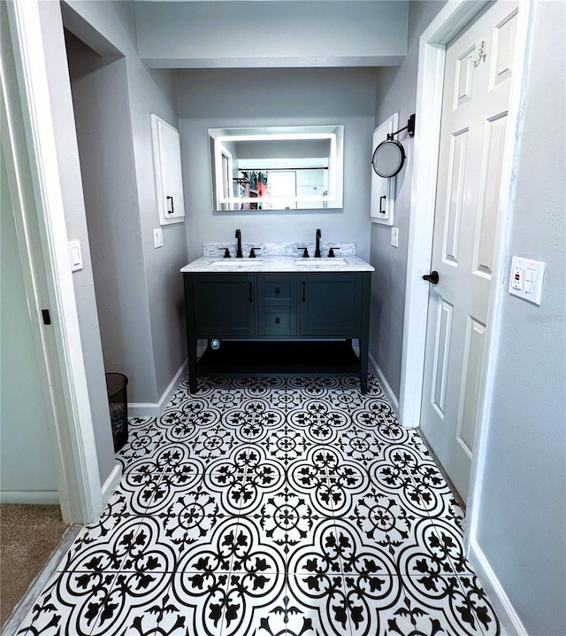 bathroom featuring tile patterned flooring and vanity