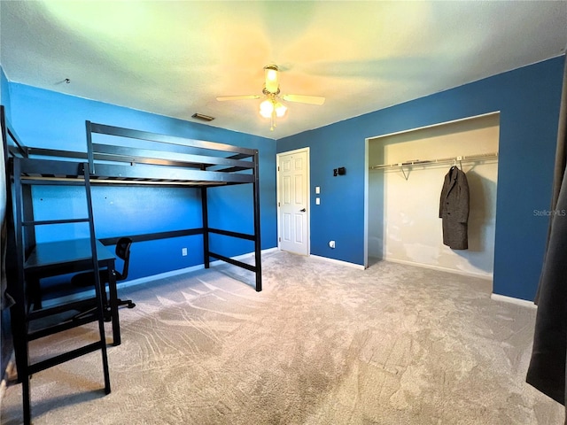 carpeted bedroom featuring ceiling fan