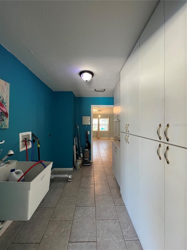 hallway featuring a textured ceiling