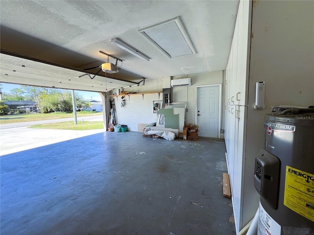 garage featuring electric water heater and a garage door opener