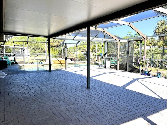 view of patio with a lanai