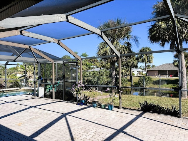 view of patio / terrace featuring glass enclosure