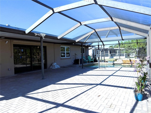 view of patio / terrace with a lanai